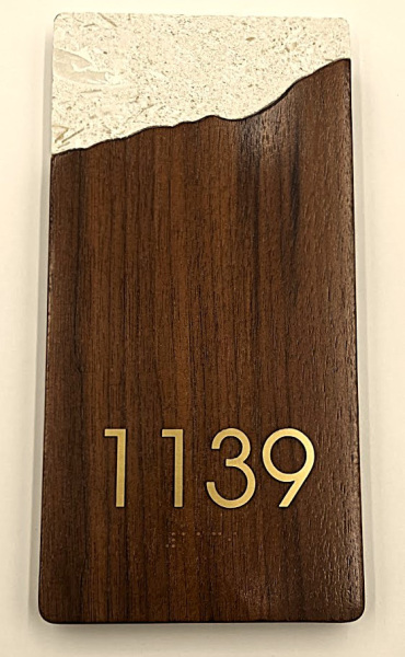 Custom wood-grain unit number sign for Omni Hotel by Baron Sign Manufacturing