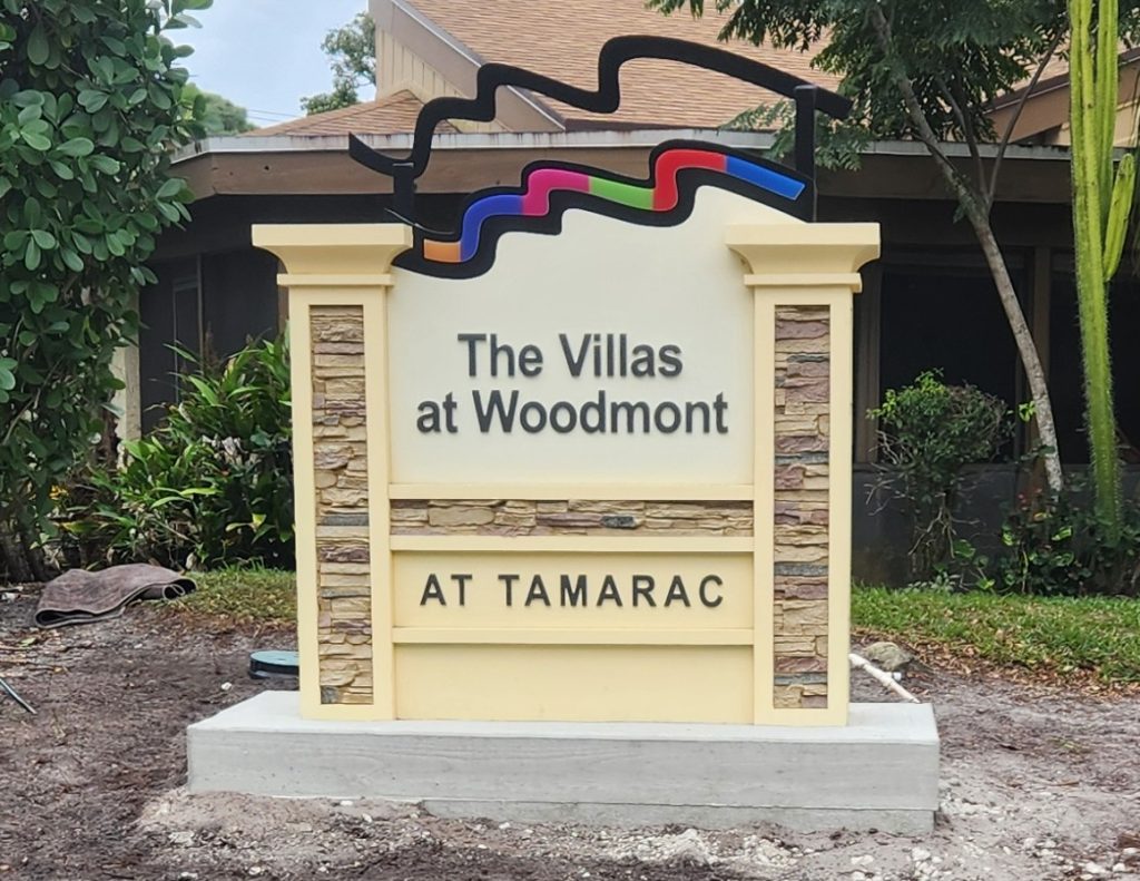 The Villas at Woodmont monument sign in Tamarac, FL - multifamily community entrance signage